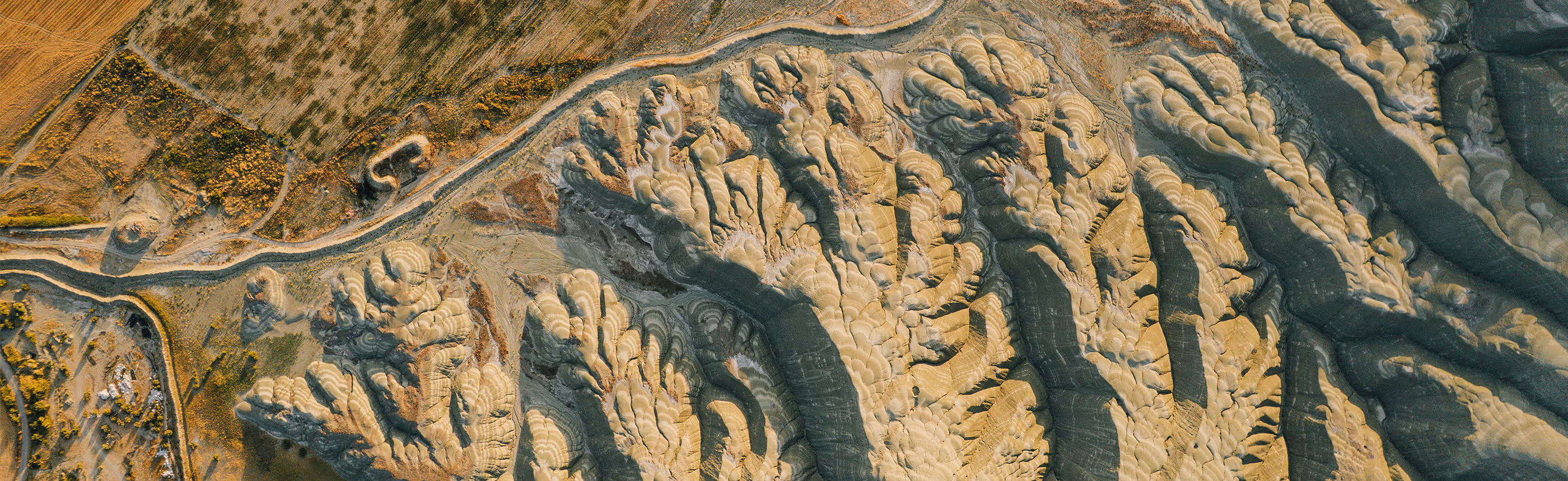 Aerial view of open-pit mine terrain