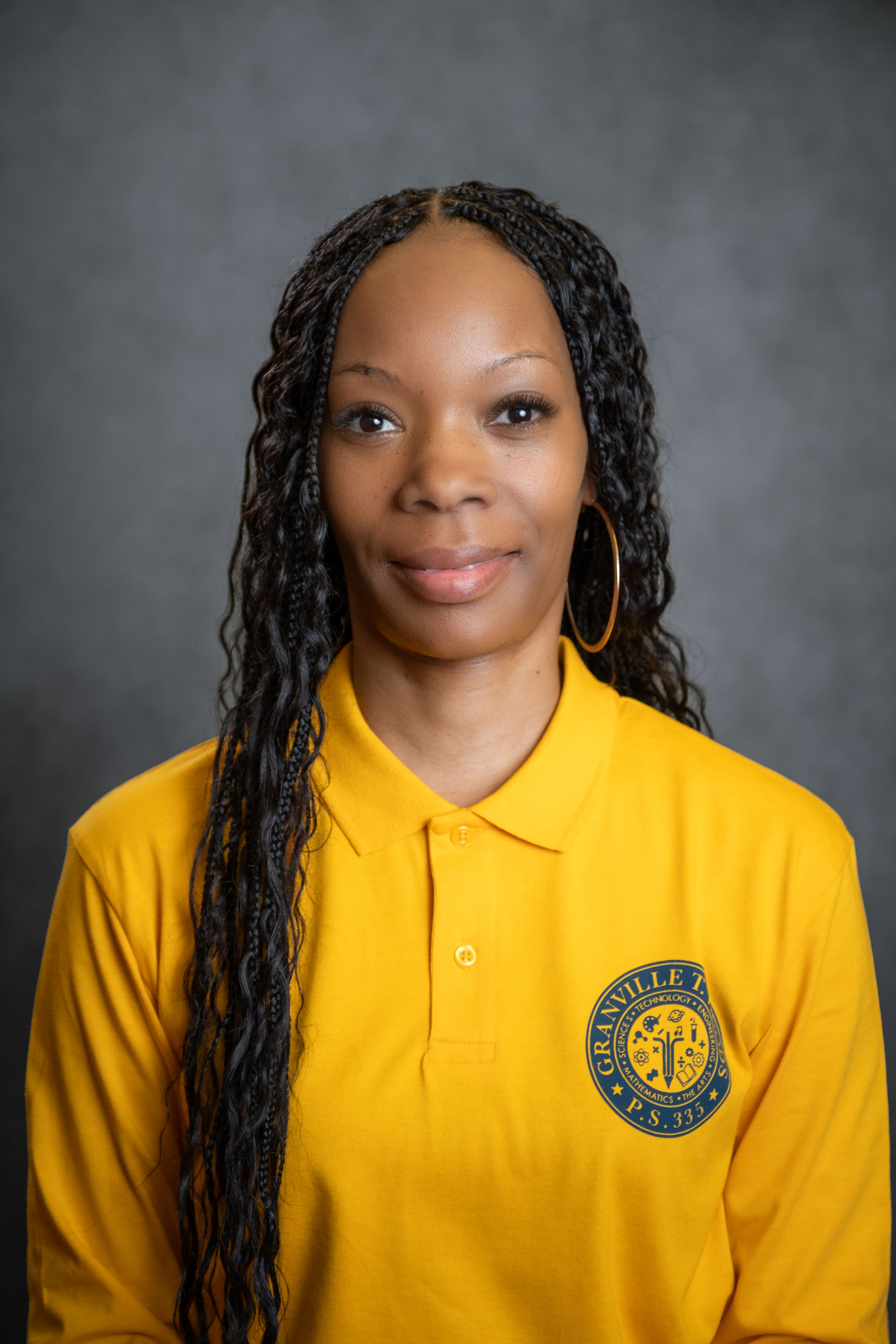 Staff member T. Davis in PS 335 school uniform polo shirt