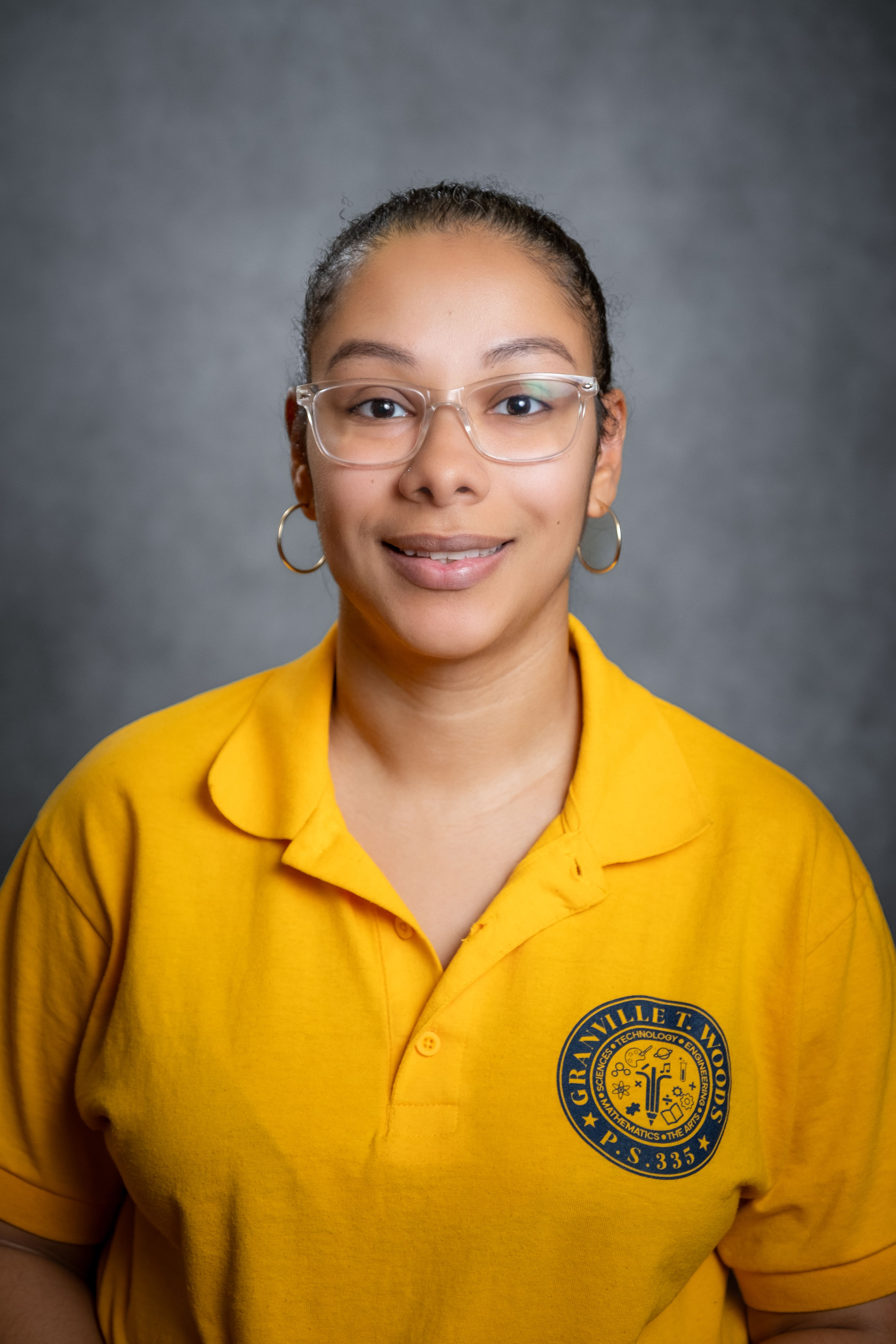 M. Vasquez staff portrait in Granville T. Woods PS 335 uniform
