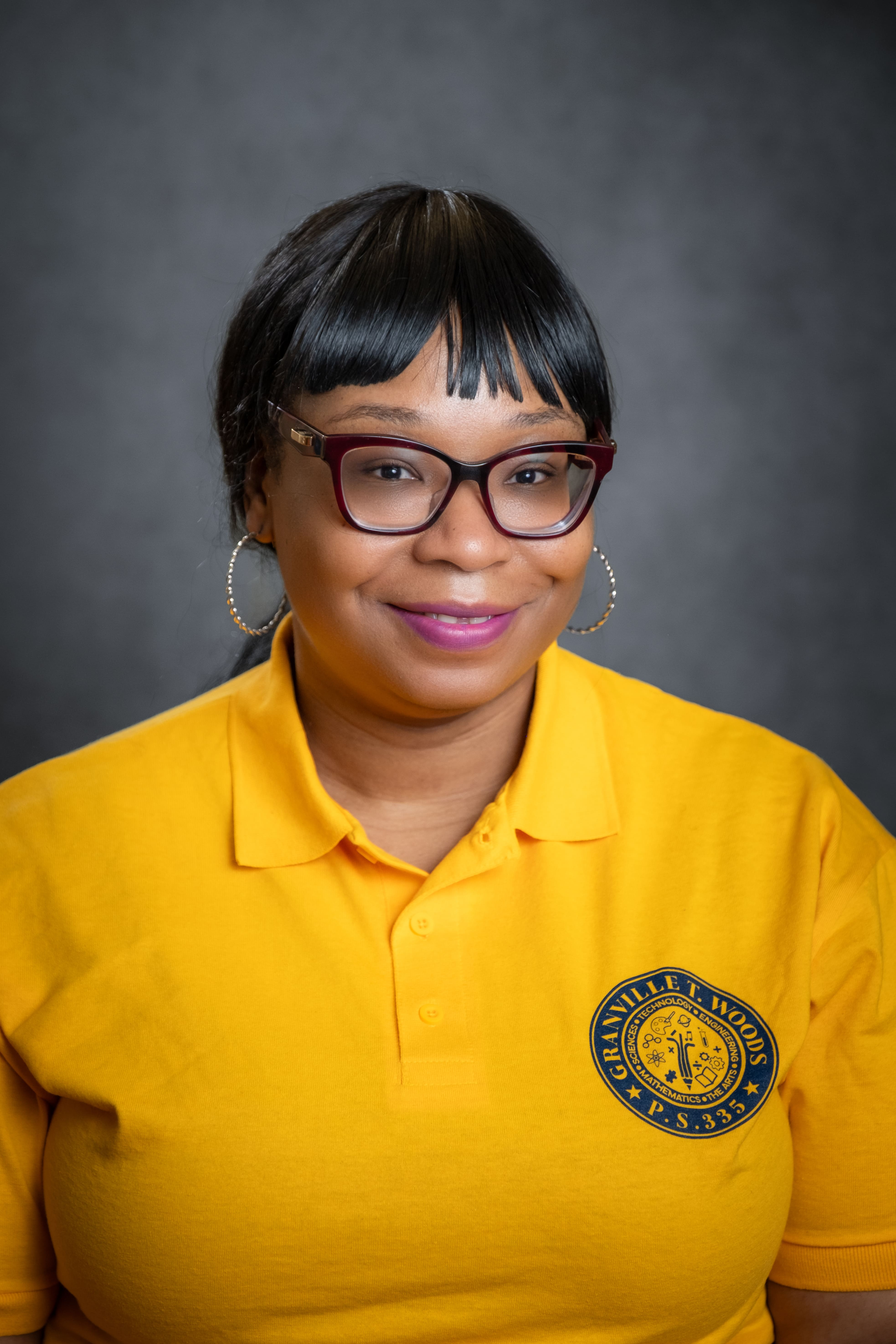 Staff member N. Yoyo in Granville T. Woods PS 335 polo shirt