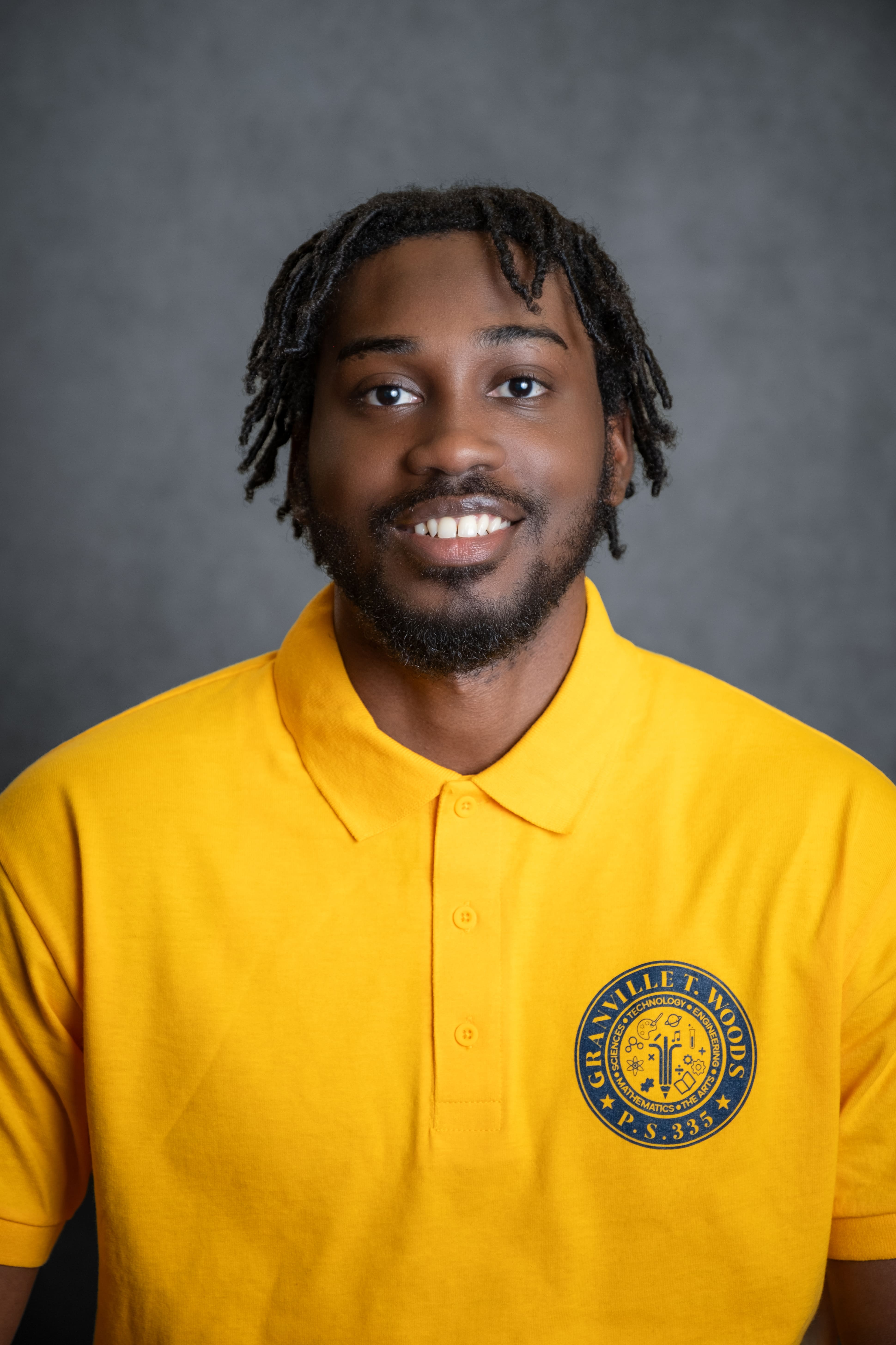 Staff member S. Belgrave in Granville T. Woods P.S. 335 polo shirt