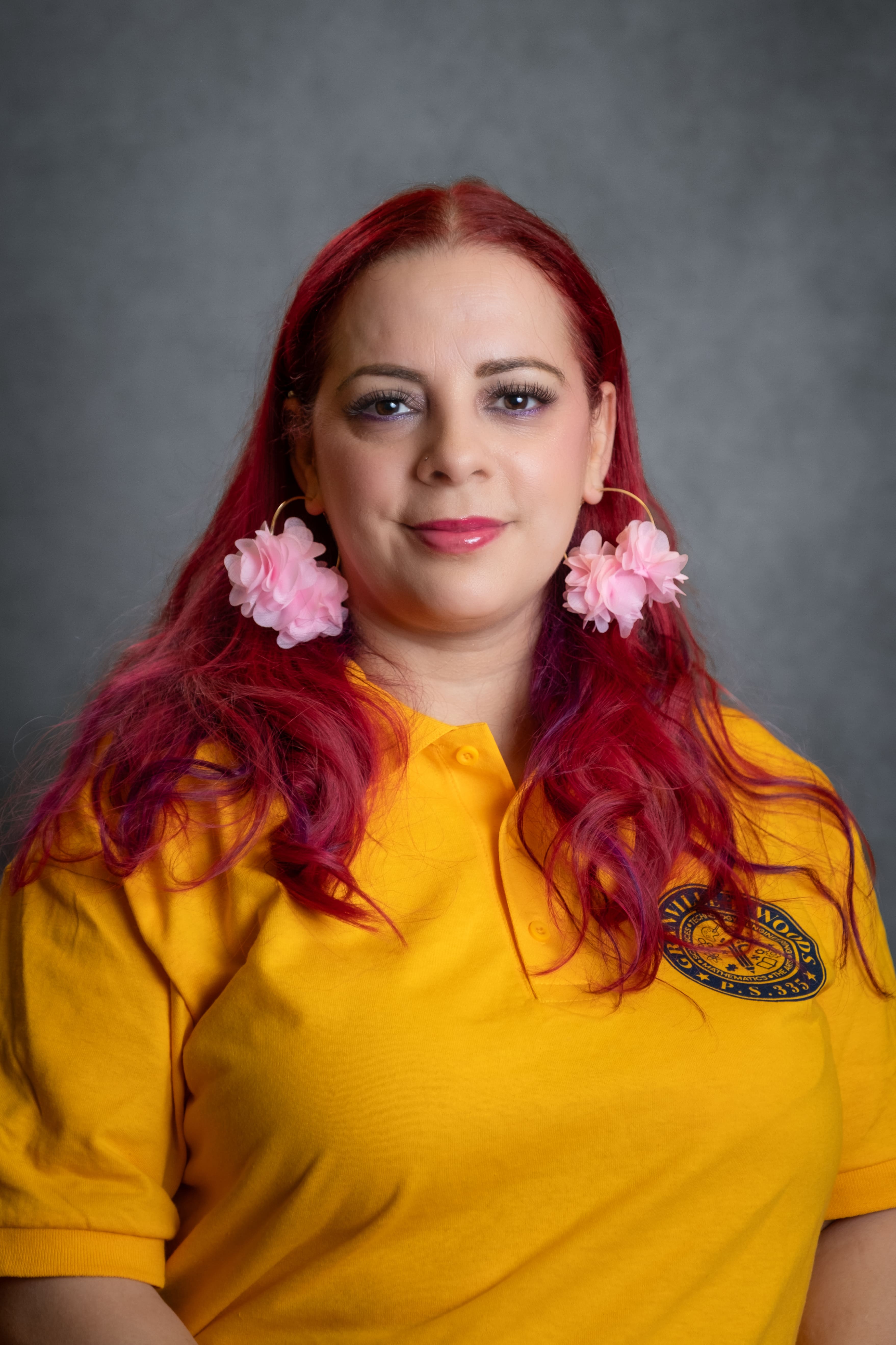Staff portrait of Ms A Velazquez wearing school polo shirt