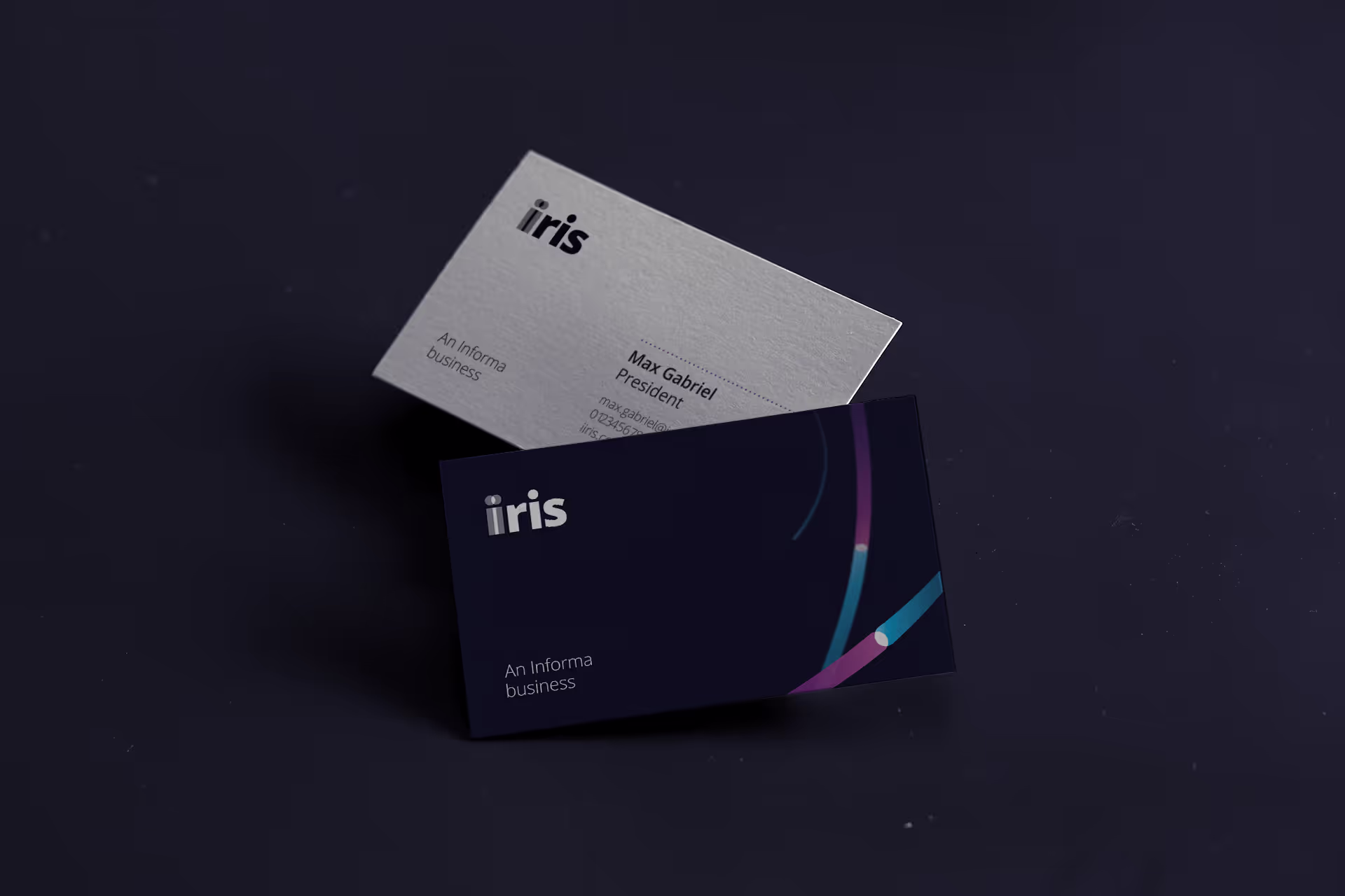 Branded IIRIS business cards, with blue and purple lines connecting