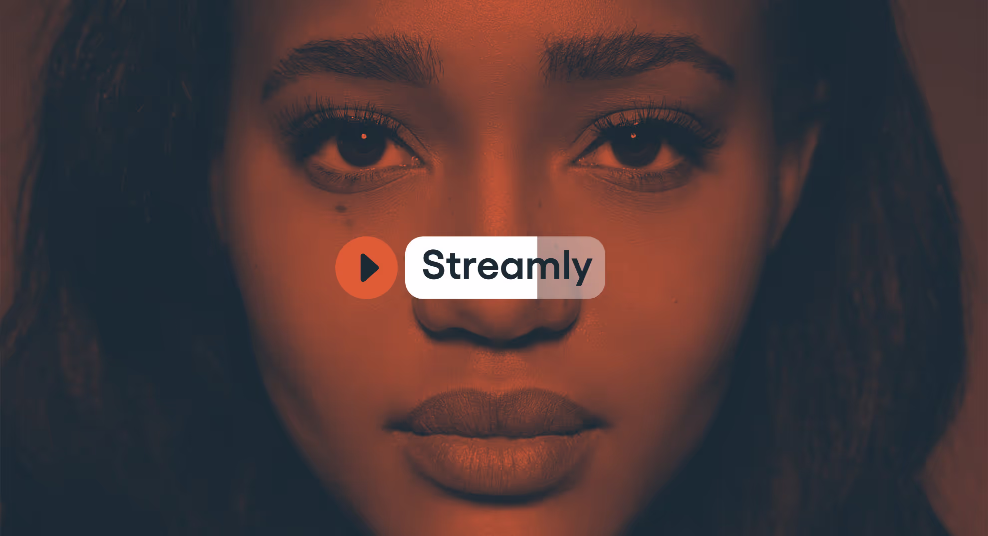 The Streamly logo over a woman's face. The woman is orange & navy duotone in style.