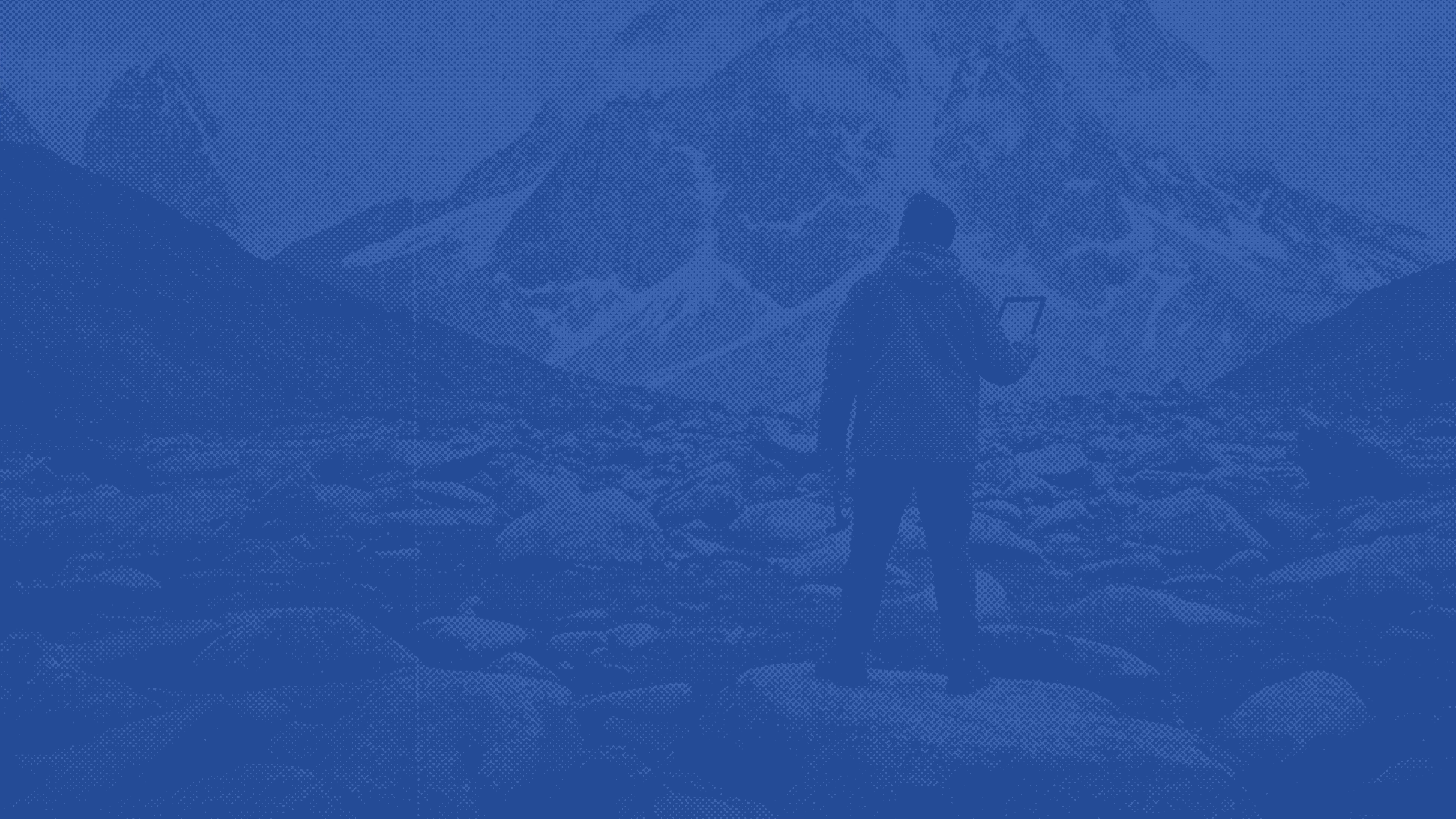 Worker installing or repairing roof shingles, shown in a blue duotone filter.