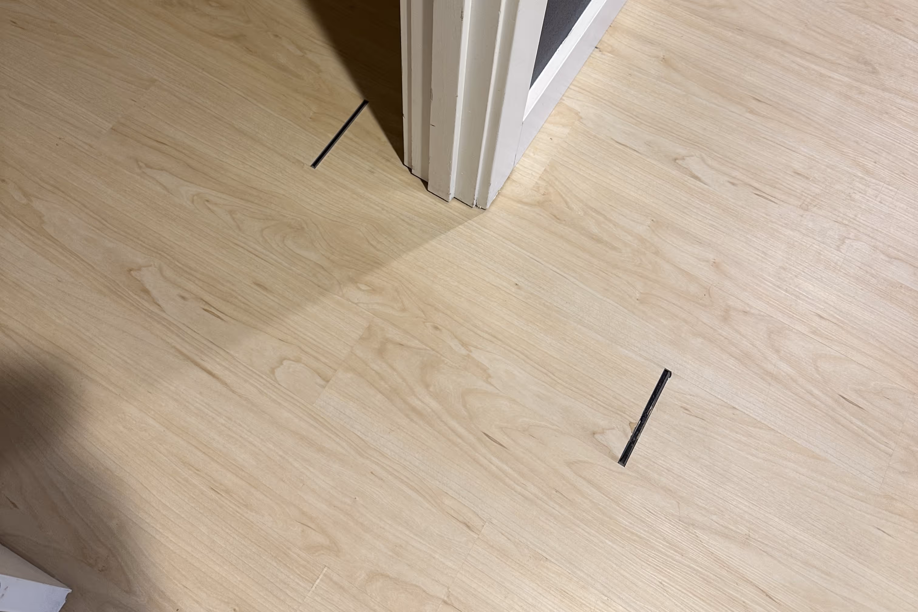 Large gaps in flooring because of poor floor preparation