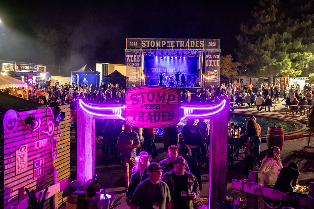 TK Events produced Stomp the Trades 2025 outdoor festival with live stage and branded neon entrance