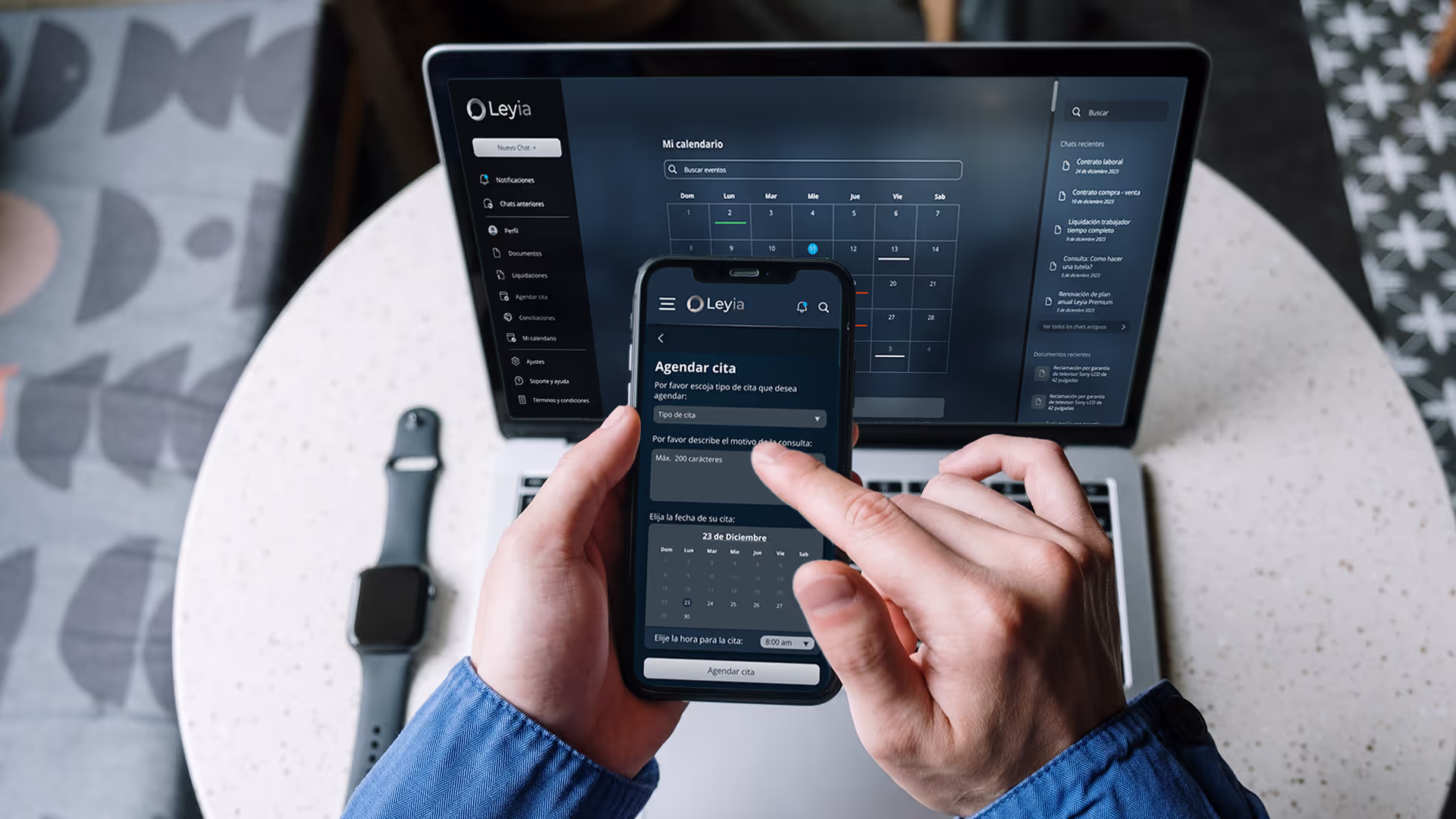 Man using Leyia's app on a phone and a laptop