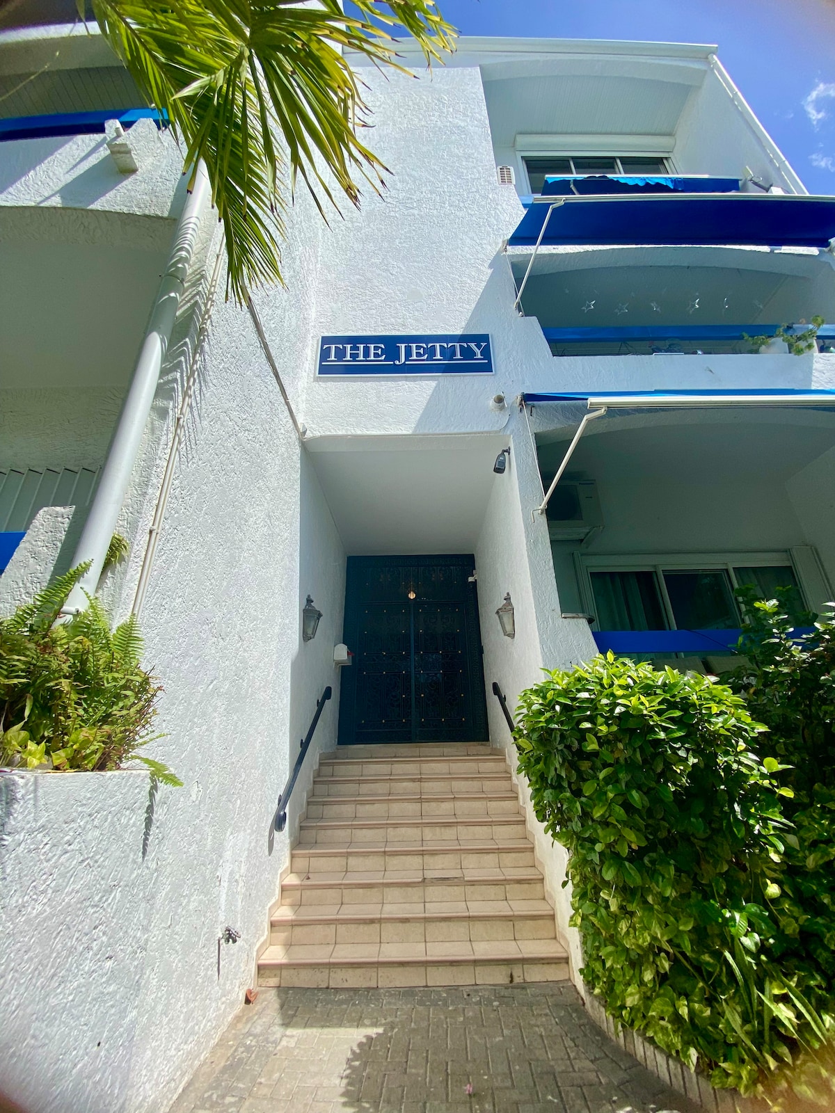 Secure gated building entrance with access code
