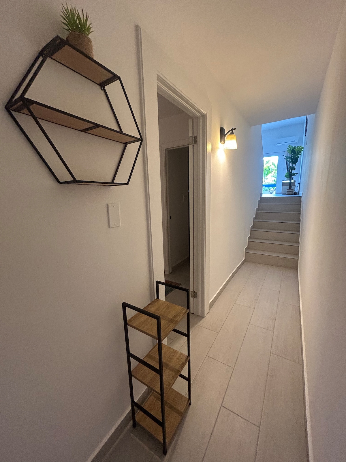Internal stairs from the first bedroom up to the living area