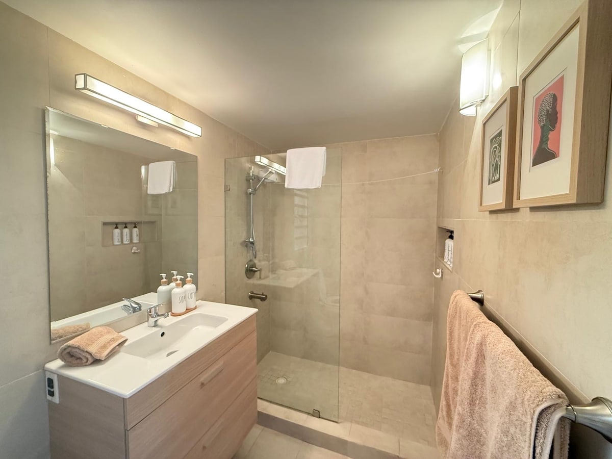 Modern bathroom with walk-in glass shower