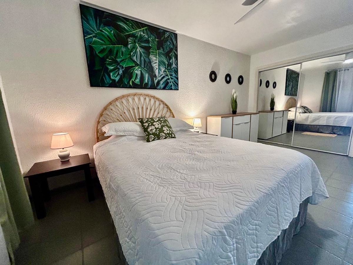 Calm, airy queen bedroom