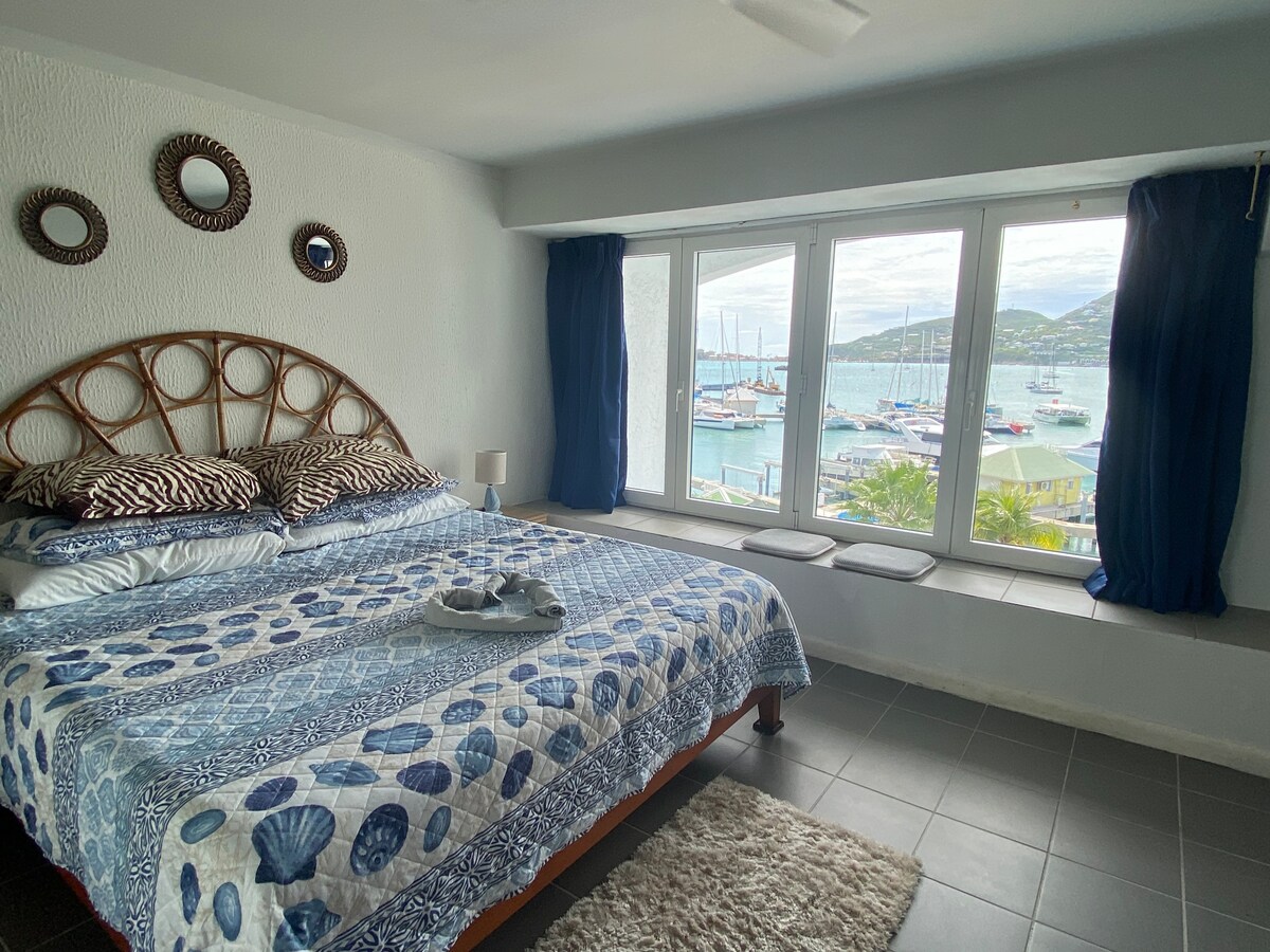 King bedroom with harbor views