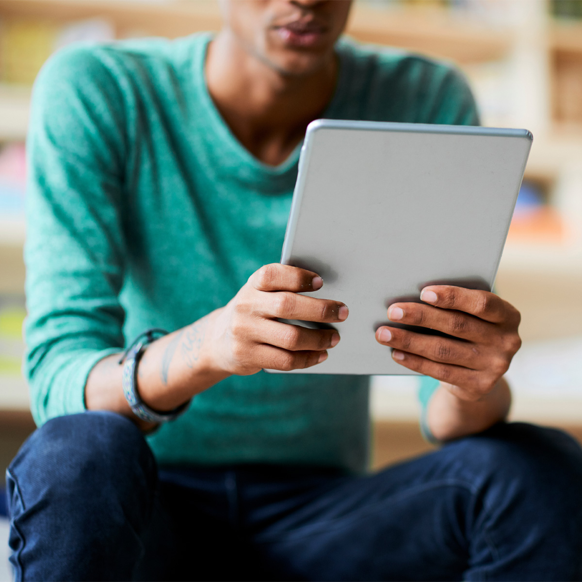 Student browsing social media on their tablet