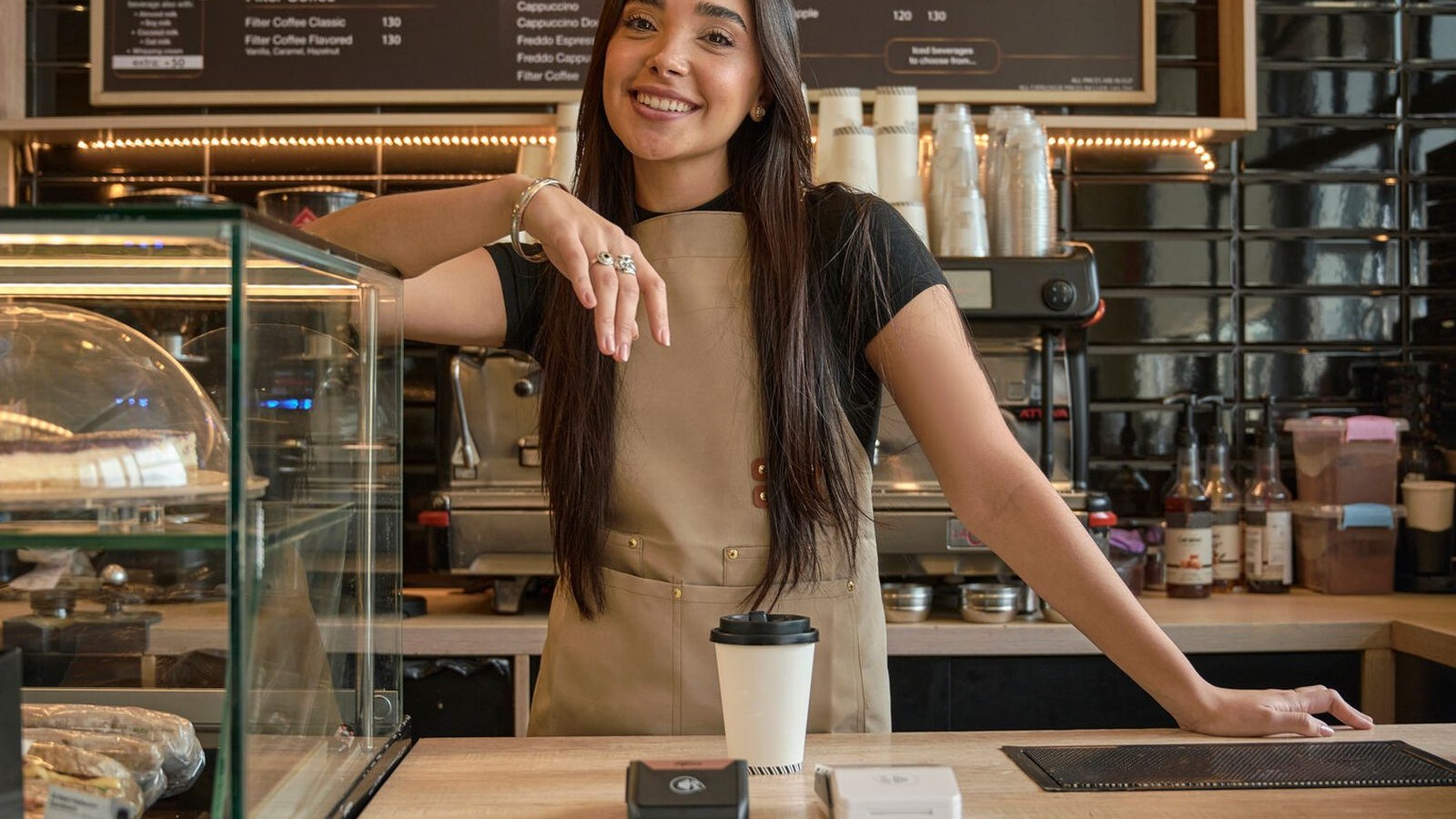 Independent shop owner behind the counter