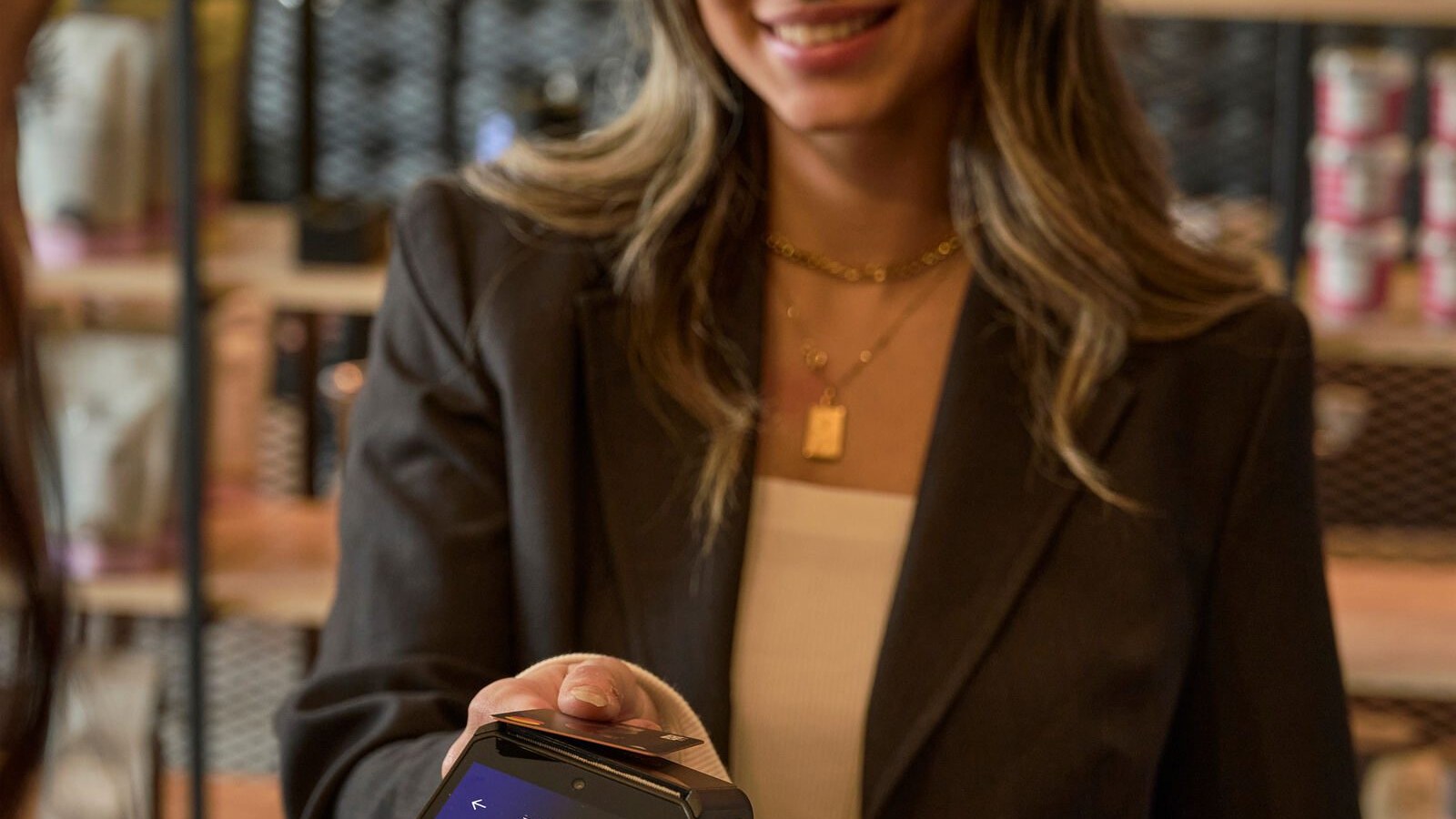 Merchant using a Zeal-enabled card machine in a bar