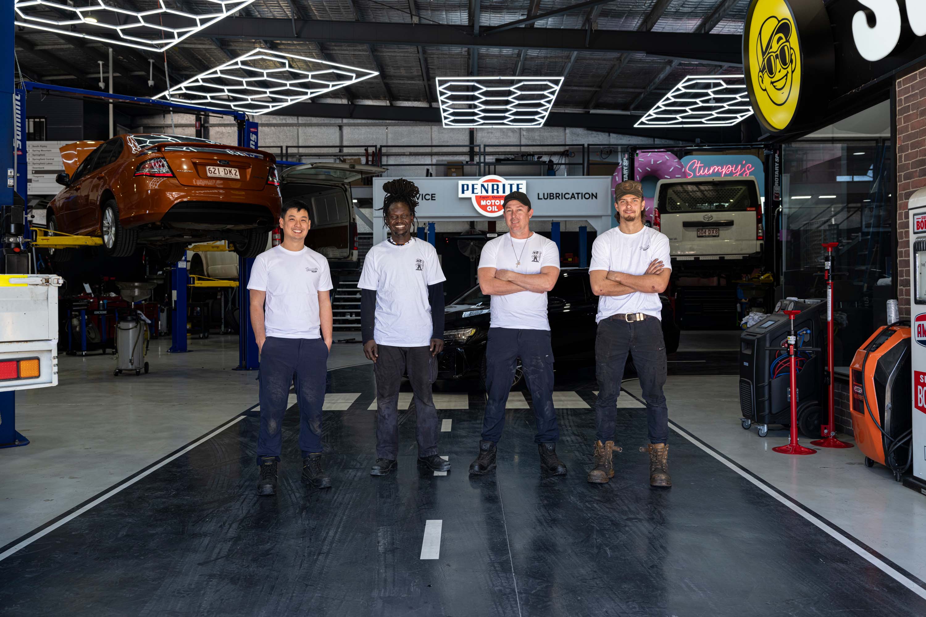 A photo of Stumpy's expert mechanic technicians in front of Redbank auto shop.