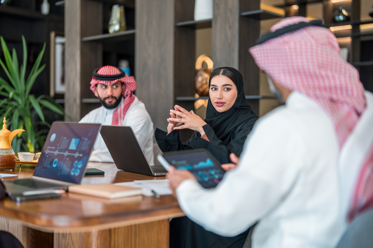 Business professionals in Saudi Arabia collaborating in a modern office setting