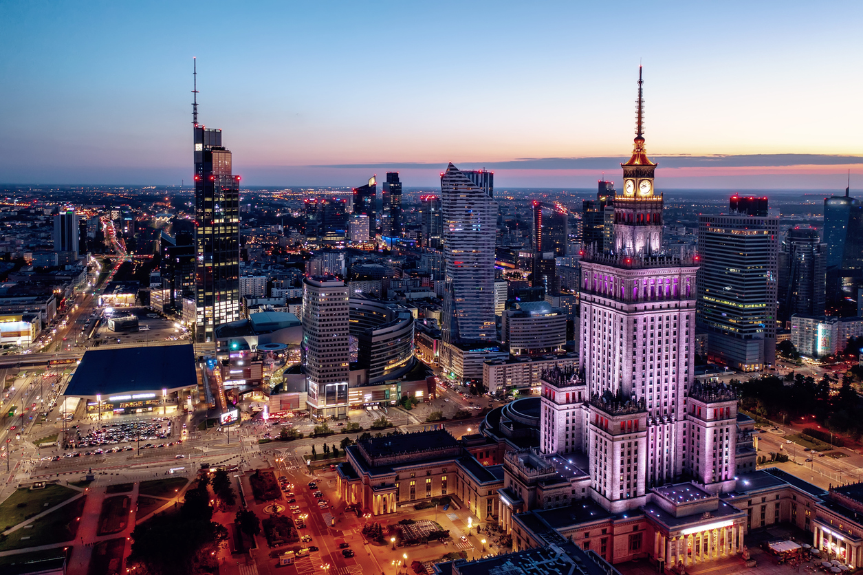 Warsaw skyline at dusk featuring the Palace of Culture and Science — Poland Temporary Residence Card and Work Permit guide