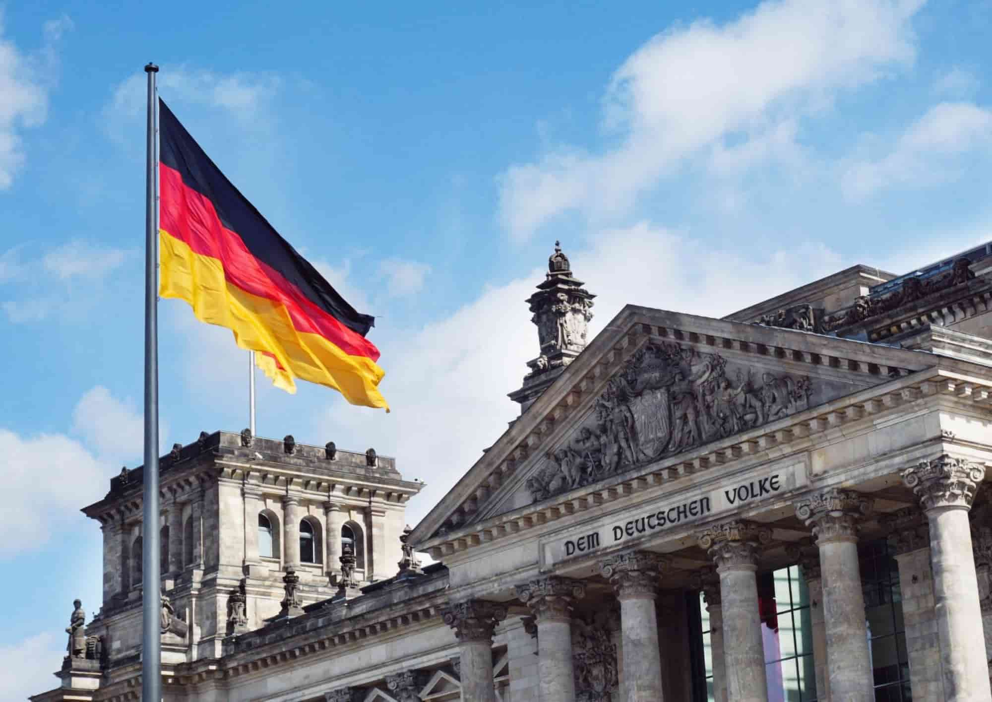 The Reichstag building in Berlin, Germany, with the German flag flying