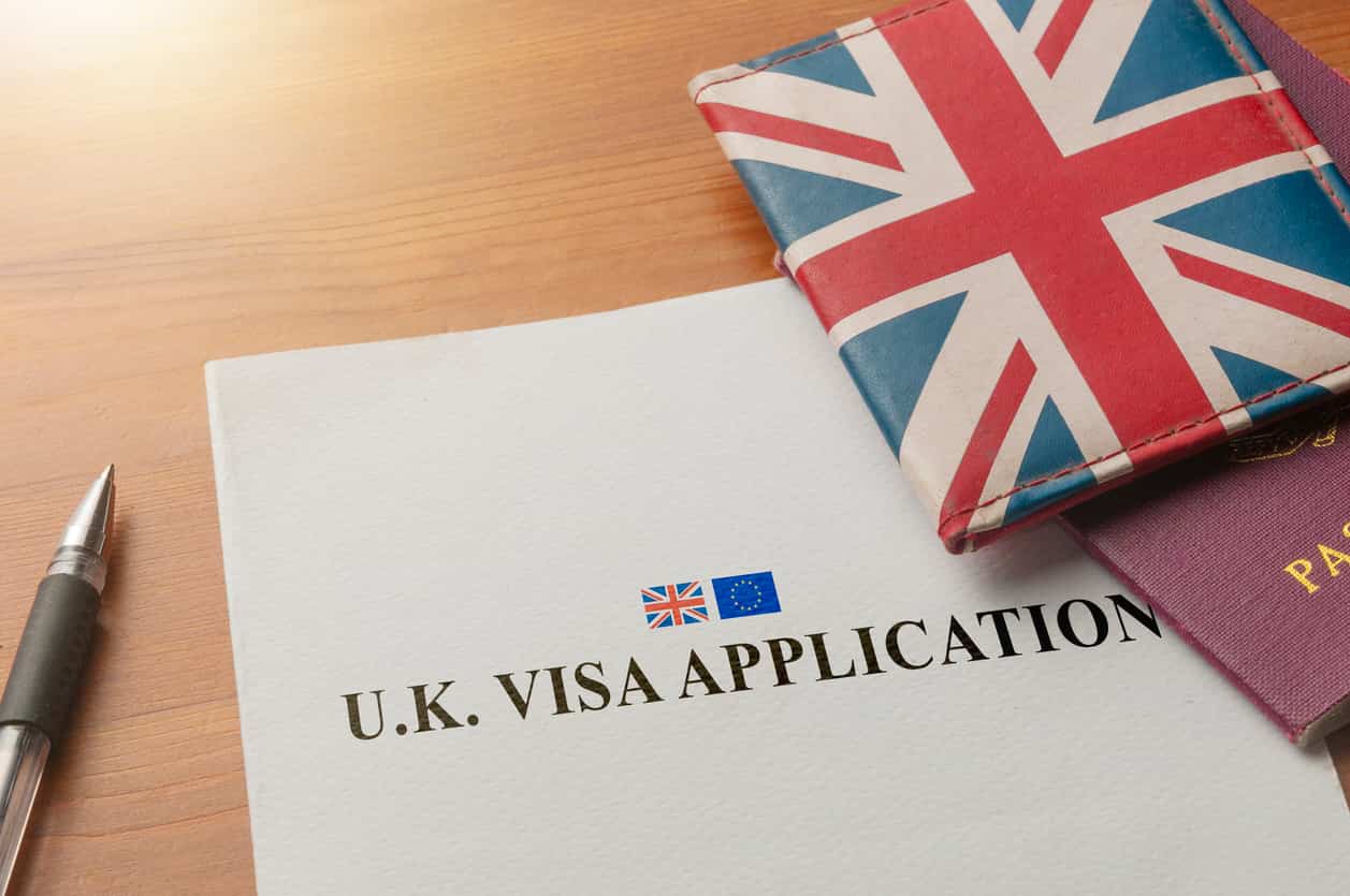 UK visa application and passport representing immigration rule changes from October 2026