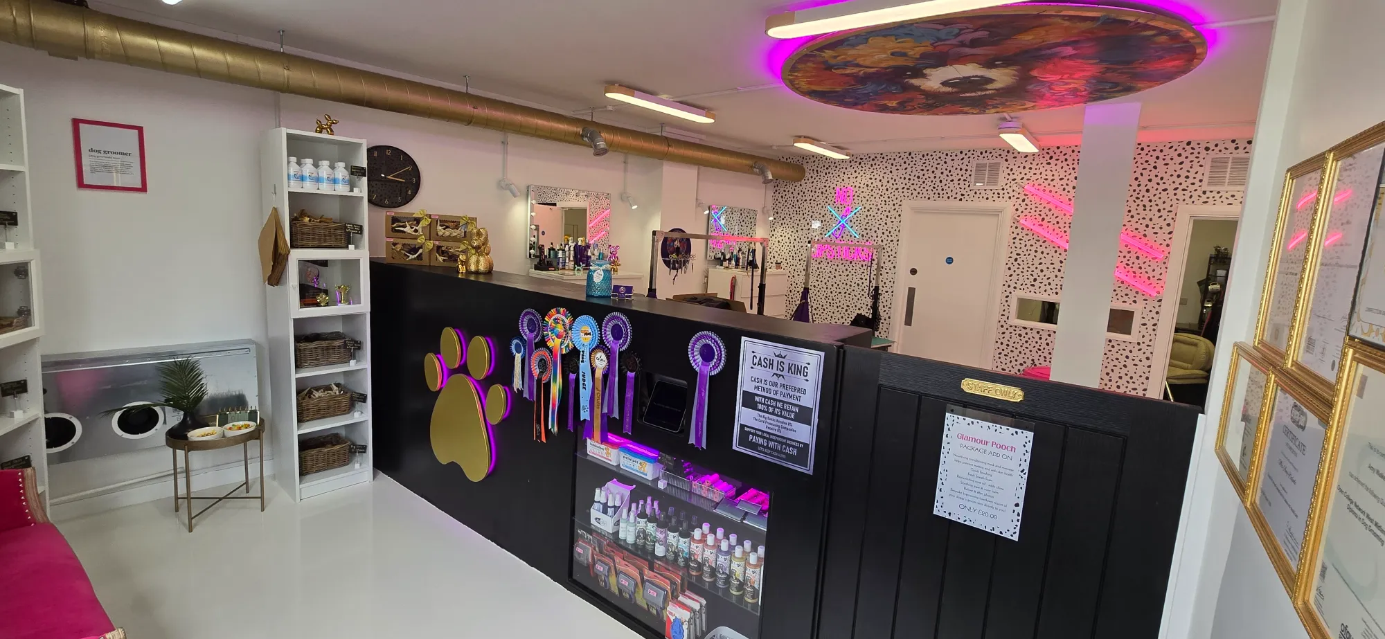 Inside the Crazy Dog Ladies, St Neots  Dog Grooming Salon. Lots of retro pink neon signage and 80's tit bits.