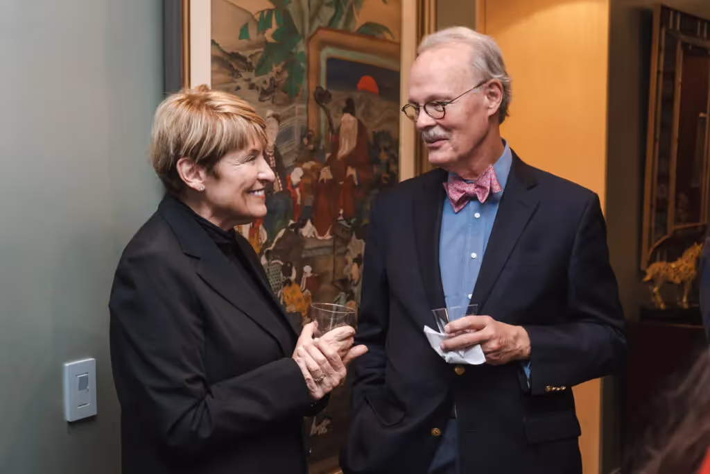 Guests Jeri Sedlar and John Baumgardner connect at the pre-concert reception.