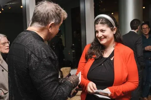 ACO Director of Development Lyndsay Werking greets composer Mark Adamo.