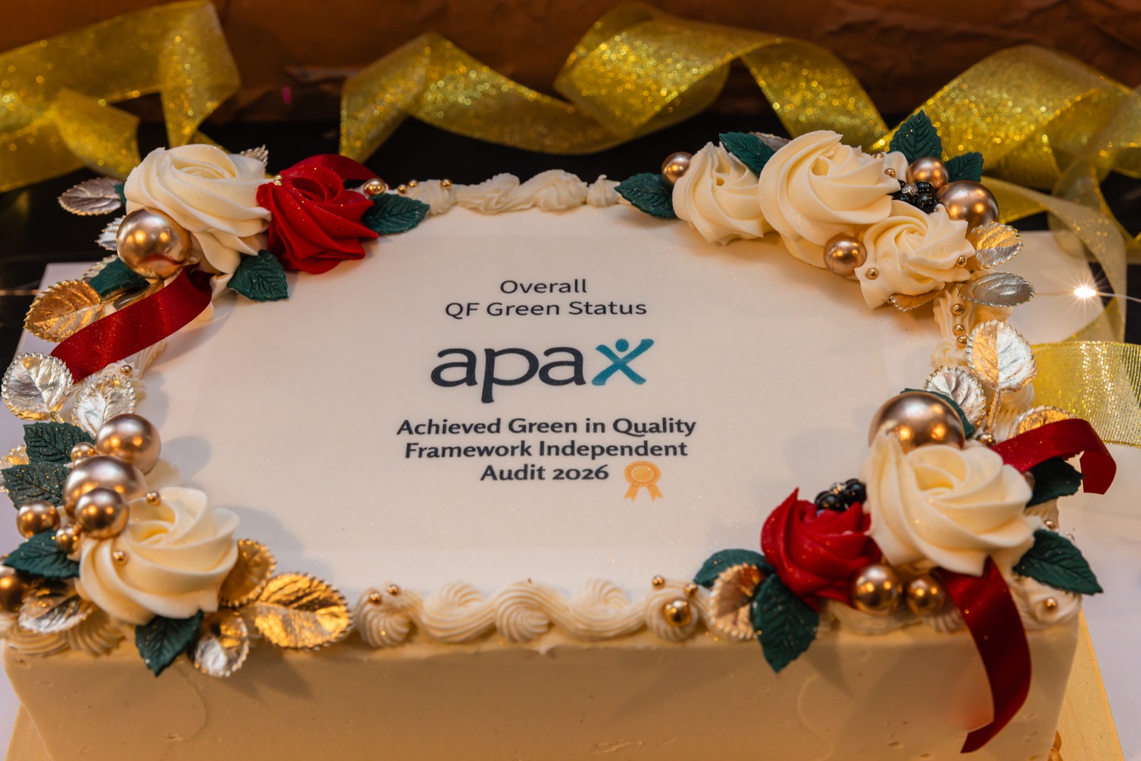 Celebration cake marking Apax's Overall QF Green Status in the Quality Framework Independent Audit 2026