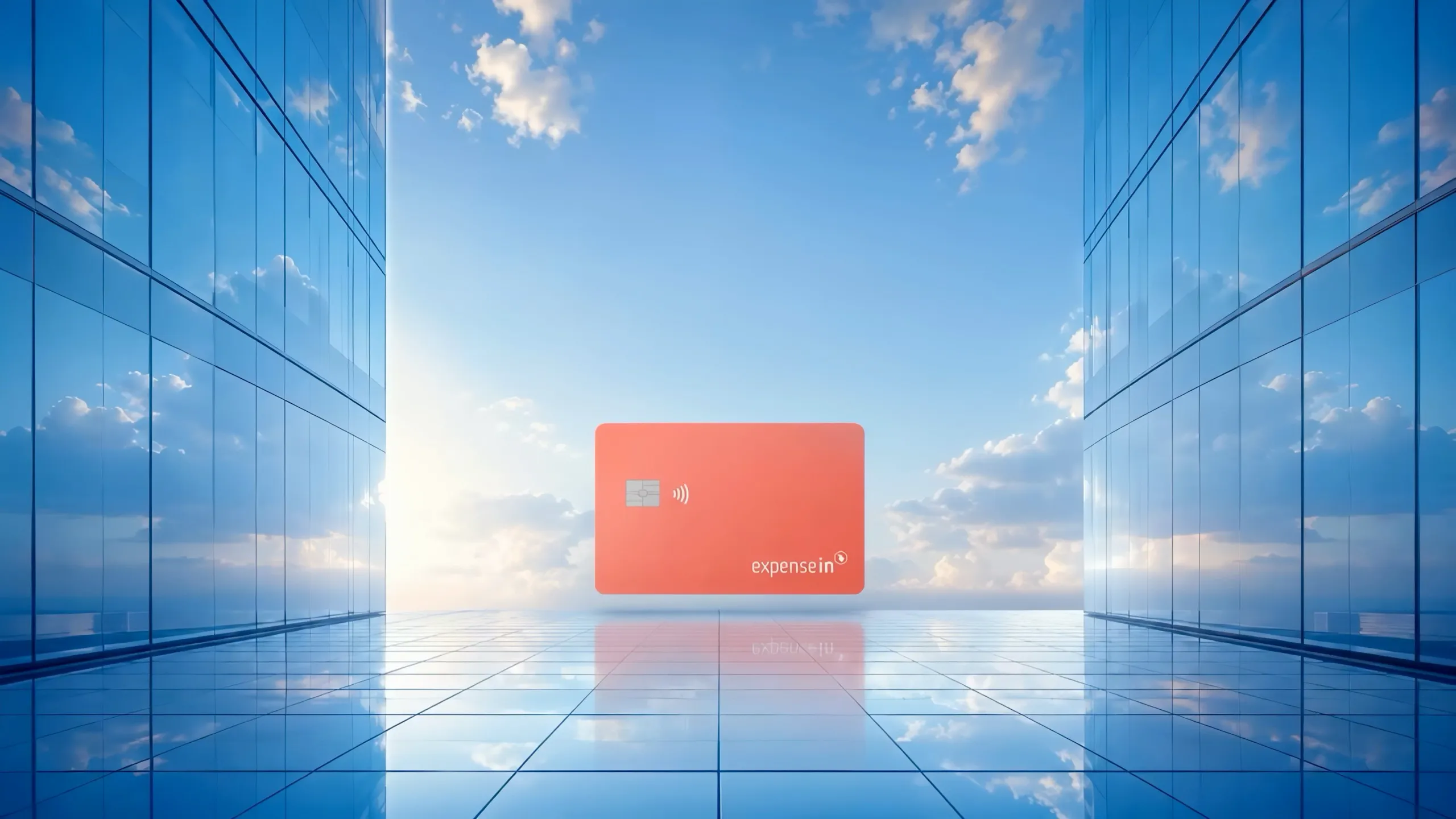 The coral ExpenseIn card standing between glass towers under a bright sky