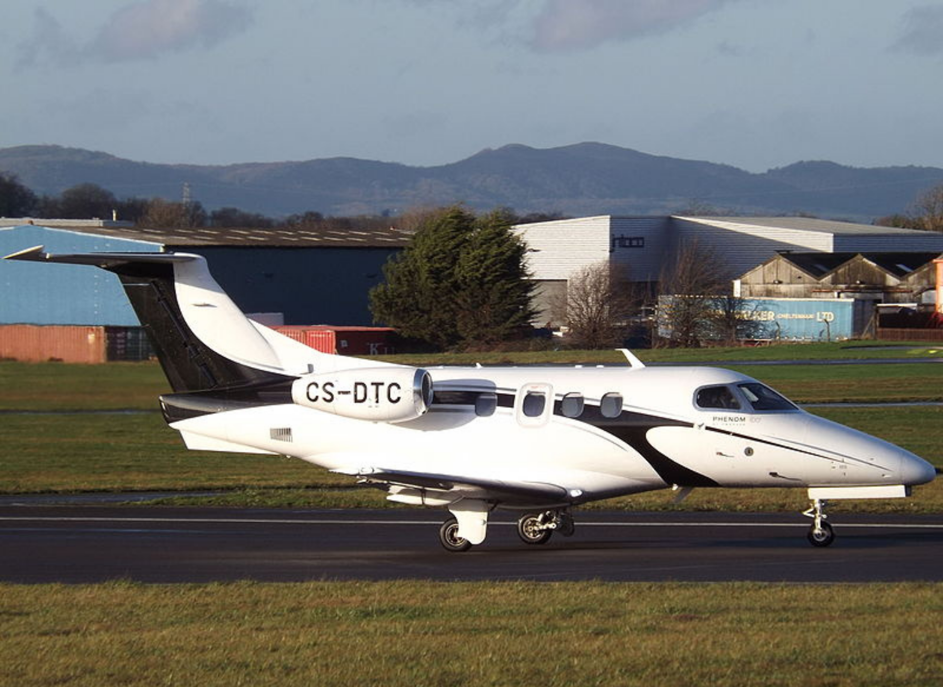 An Embraer Phenom 100 on runway before takeoff