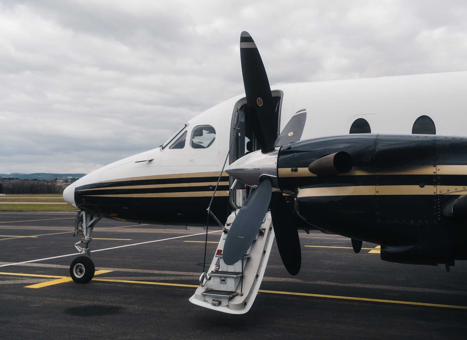 Beechcraft 1990D in white color on the runway