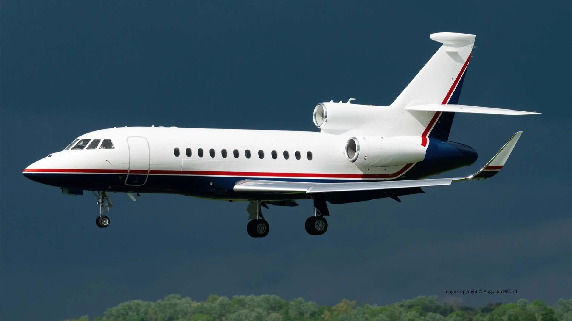 Dassault Falcon 900LX on final approach, long-range trijet private jet available for charter
