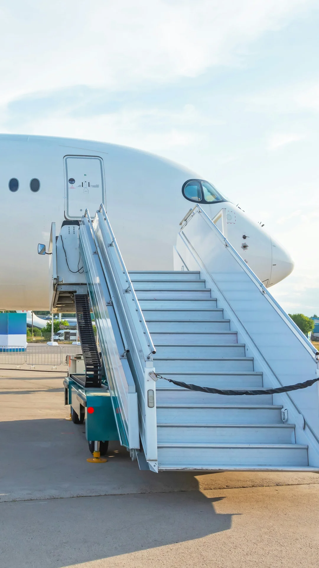 An airbus A350 parked at the airport during a sunny day