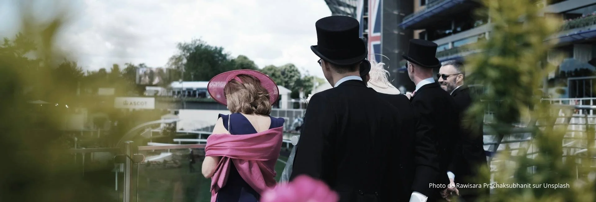 Elegant spectators in traditional attire at Royal Ascot racecourse