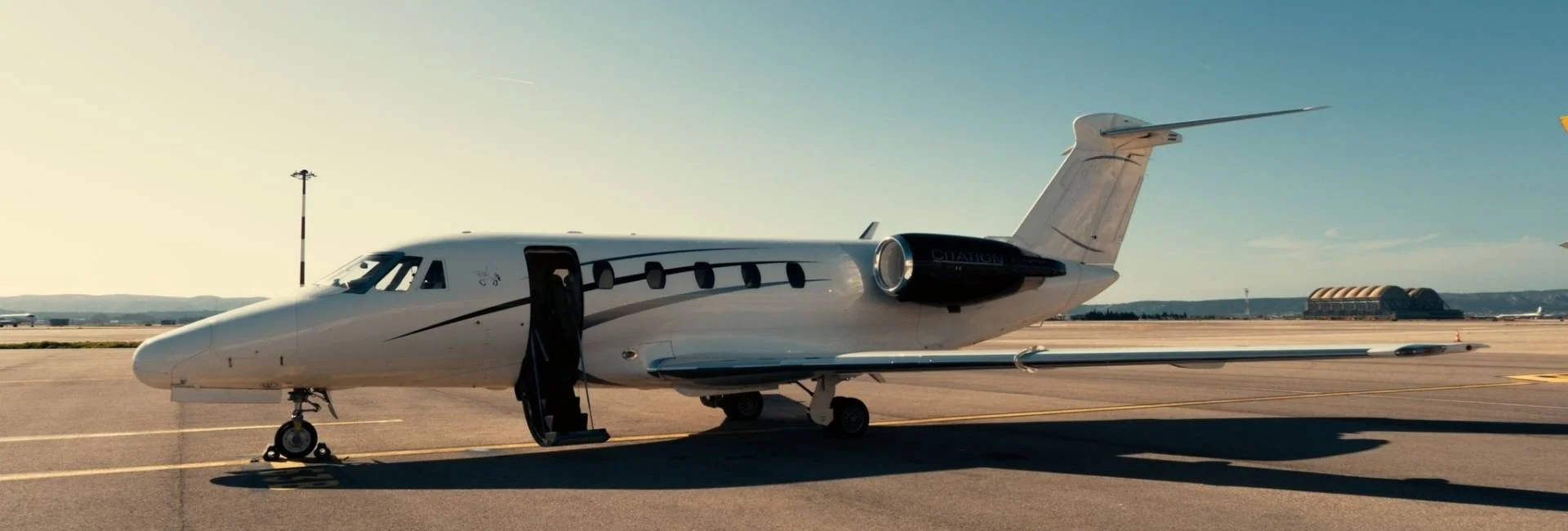 Private jet on runway for exclusive travel to a major football event