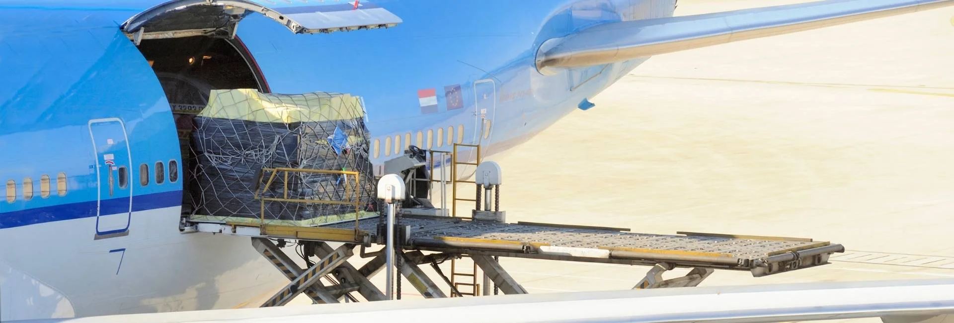 Loading sports equipment into aircraft for an international football event