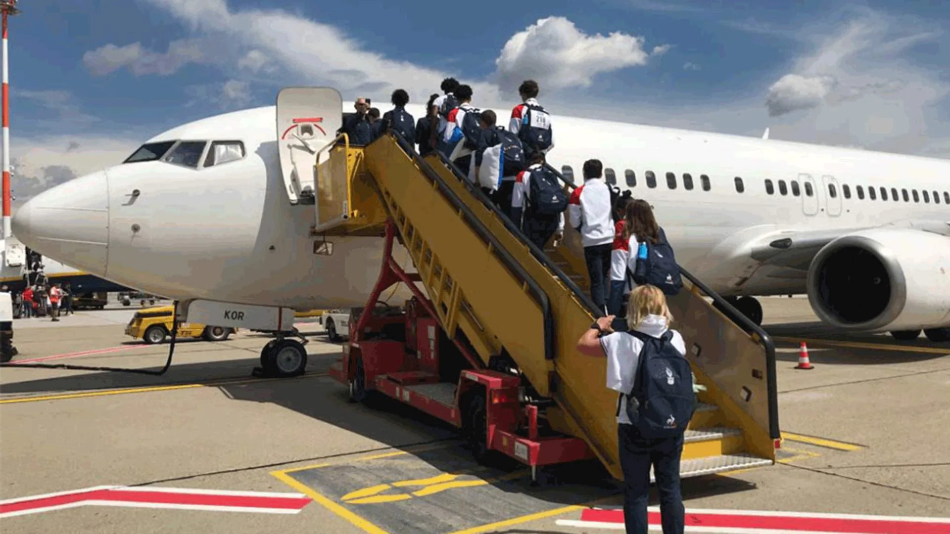 team boarding charter aircraft in Budapest