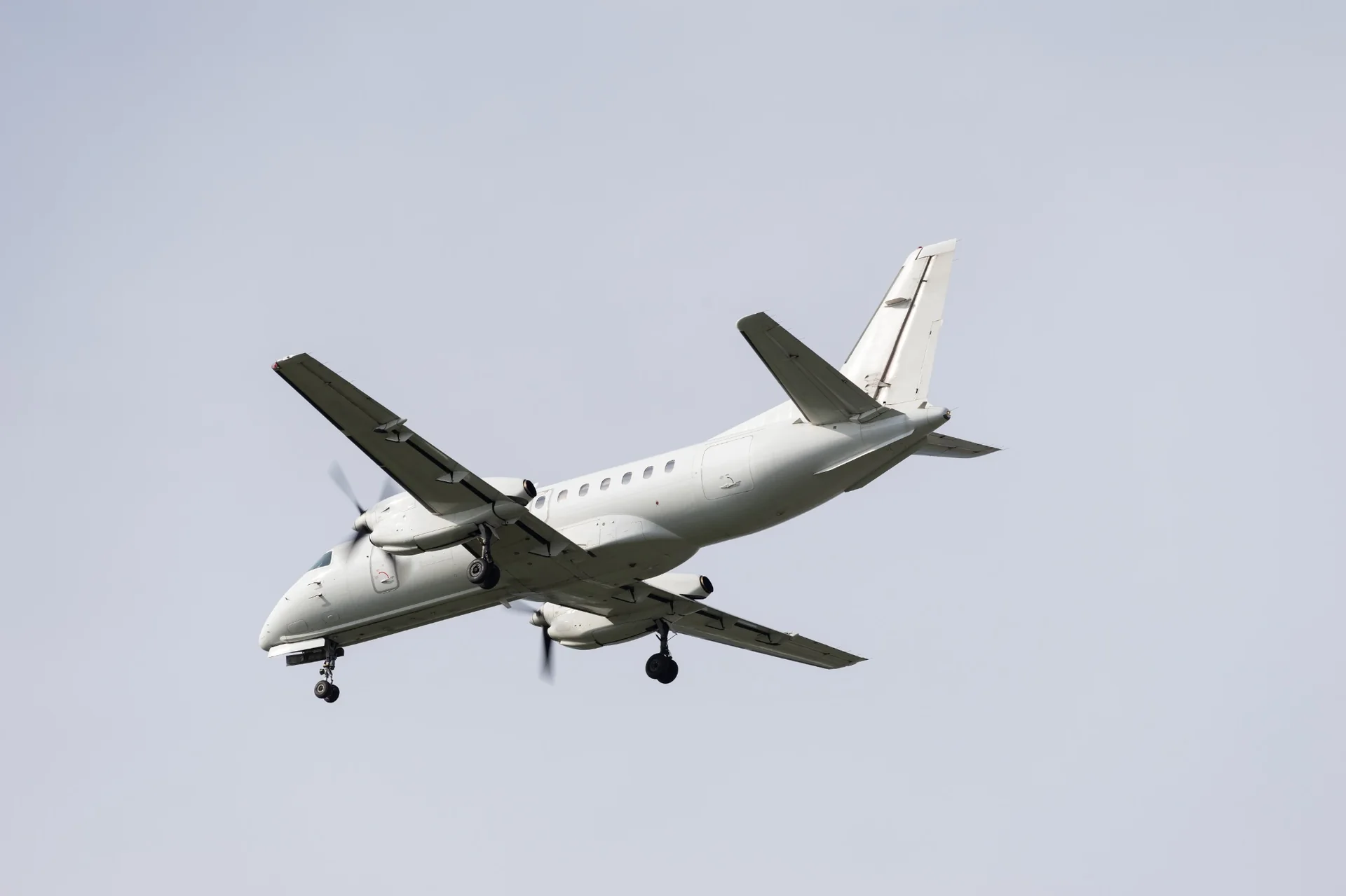 Saab 340 turboprop aircraft on final approach for a private charter flight