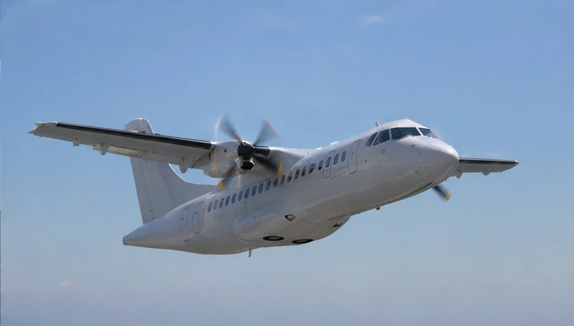 Front angle view of an ATR 42 aircraft climbing after takeoff