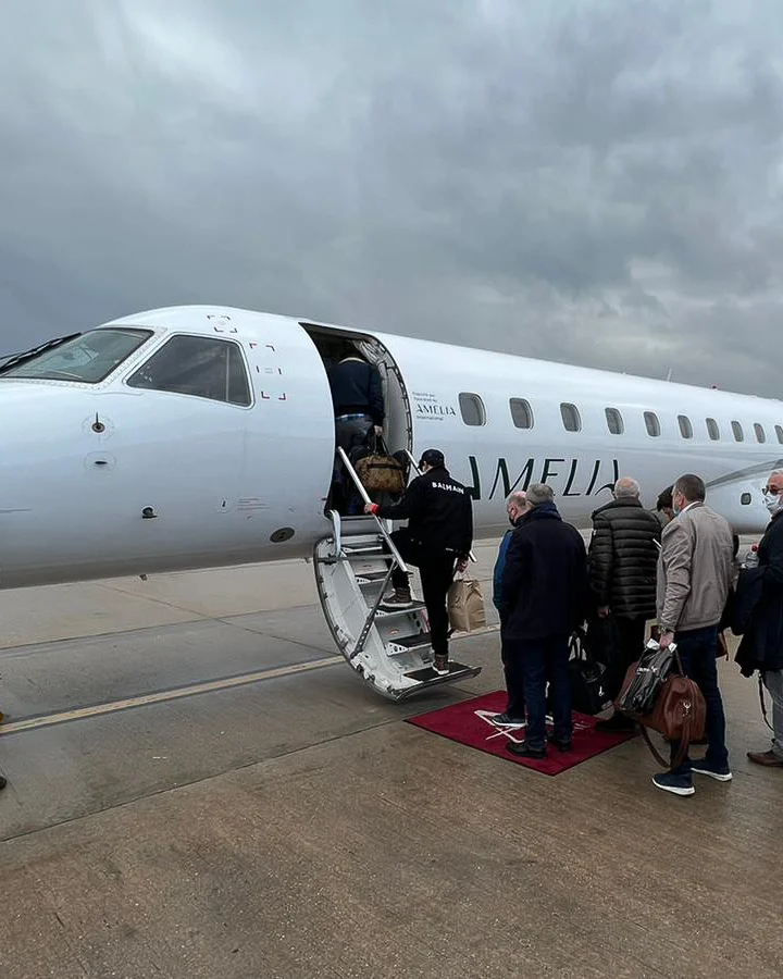 Passengers boarding an ERJ145 aircraft operated by Amelia International
