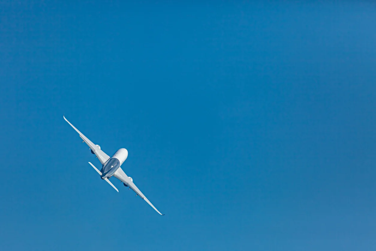 Passenger aircraft in flight seen from below