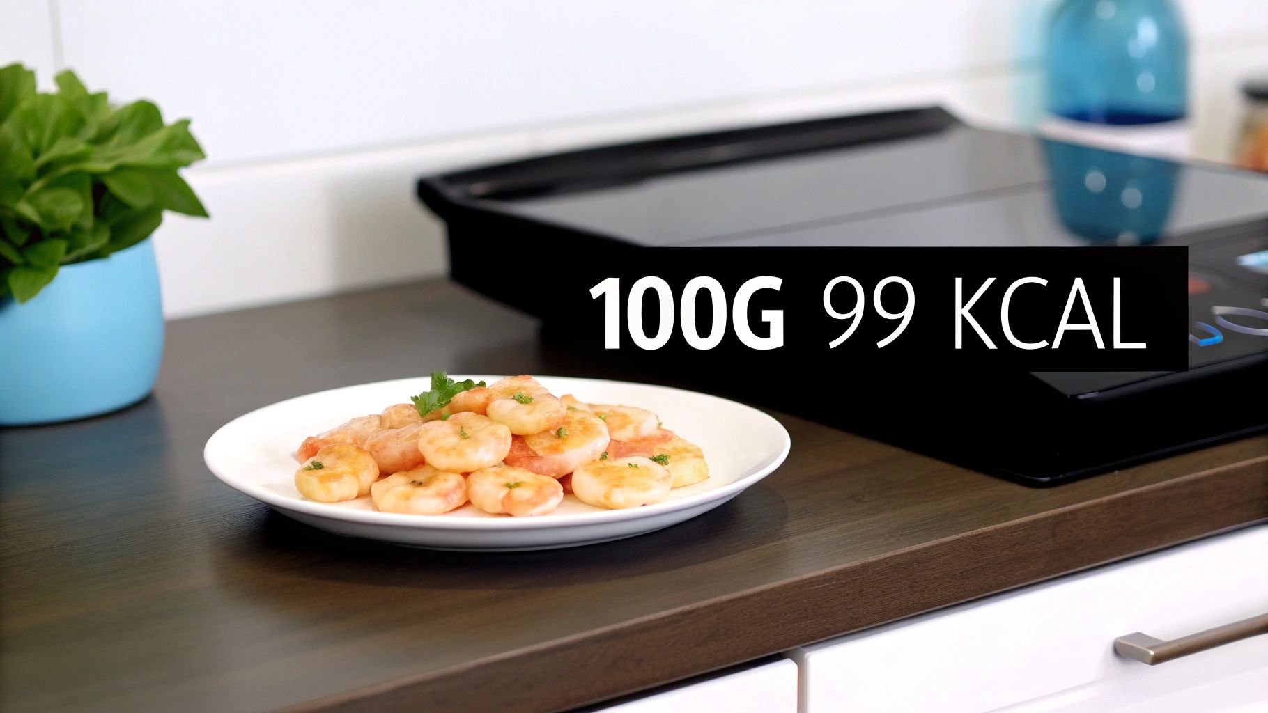 A plate of cooked shrimp with parsley and a '100g 99 kcal' label on a modern kitchen counter.