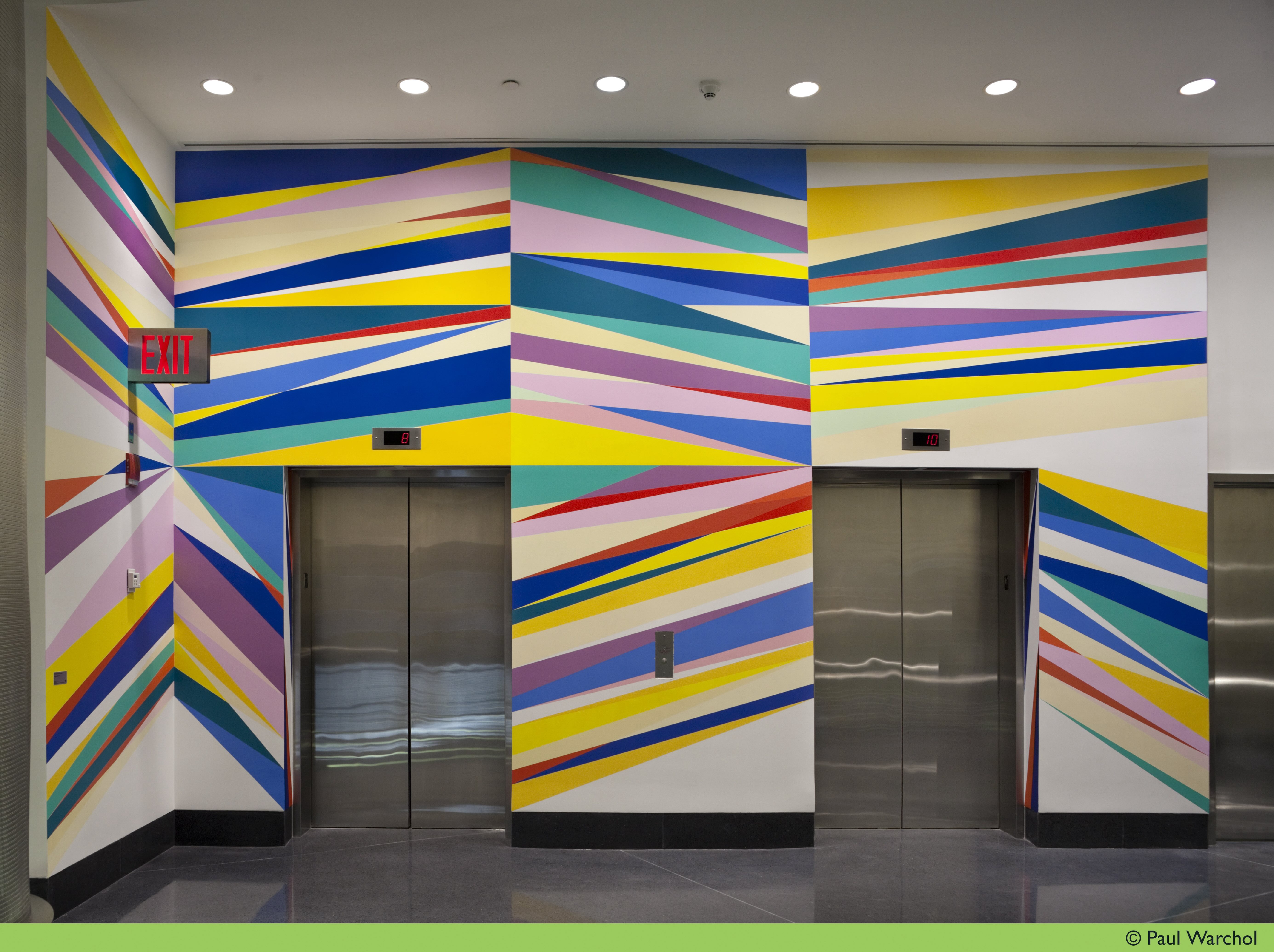 A full wall painting surrounding two elevator doors by Odili Donald Odita