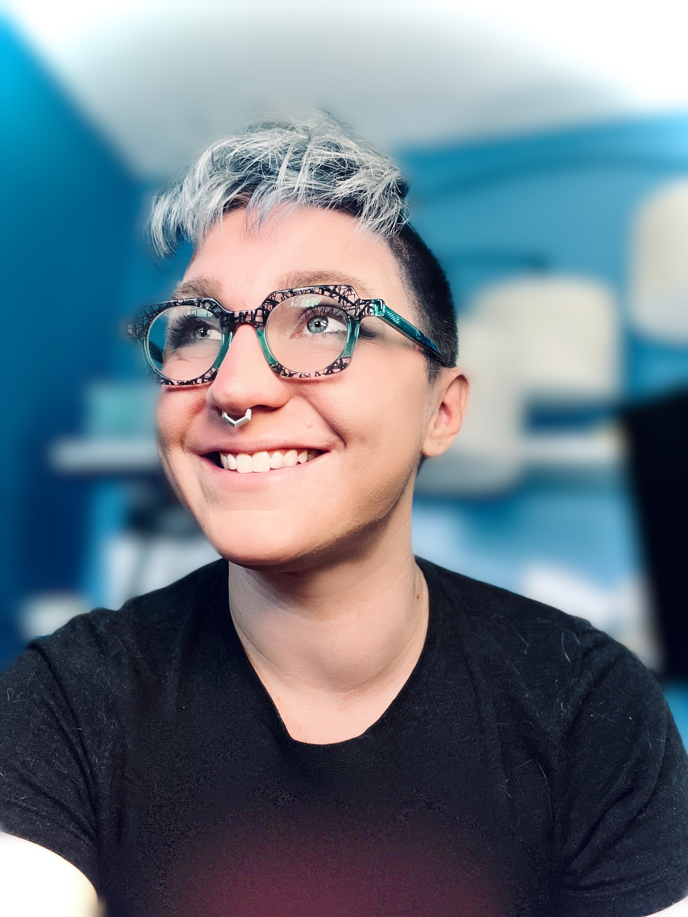 bitmap style portrait of a person with light skin and glasses with short silver hair with chartruese and lavendar accents