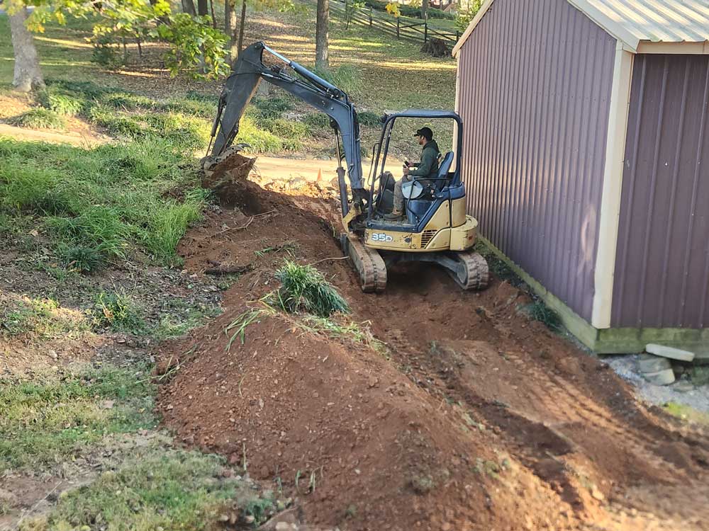 an excavator grading land