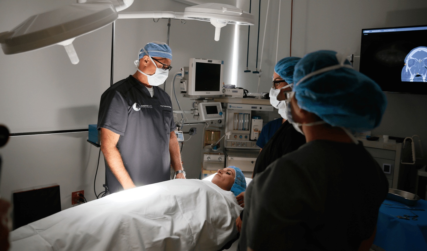 Sinus surgery team preparing a patient in a modern operating room, highlighting advanced care from the best sinus surgeon in Los Angeles.