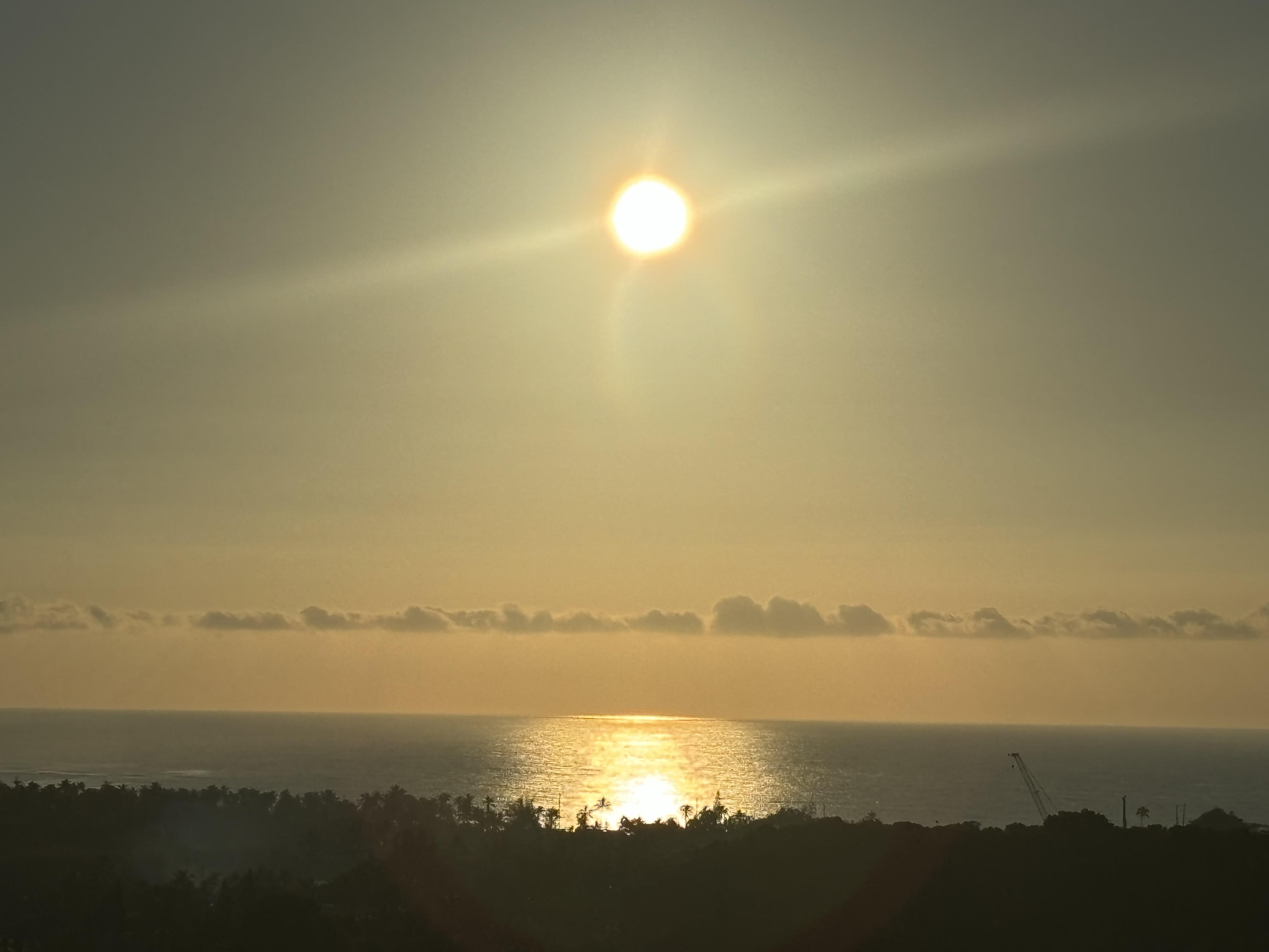 The sun setting over the ocean seen from Kauai