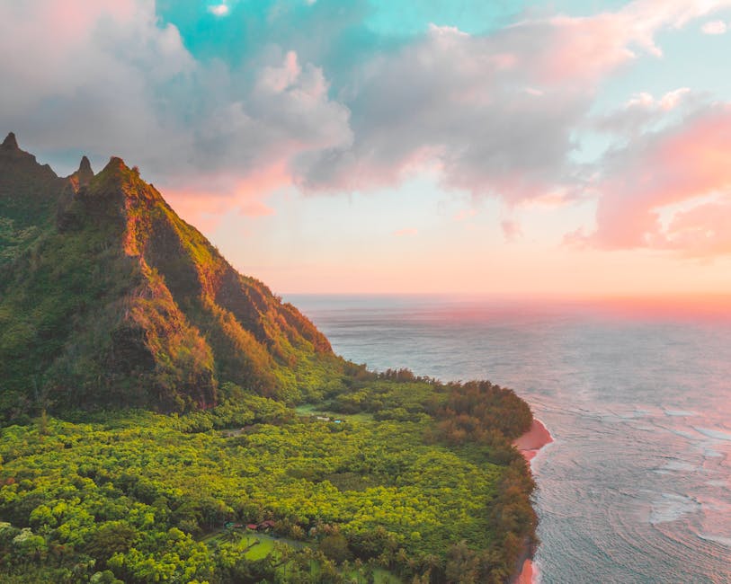 A green ridge above the Kauai coastline at sunset