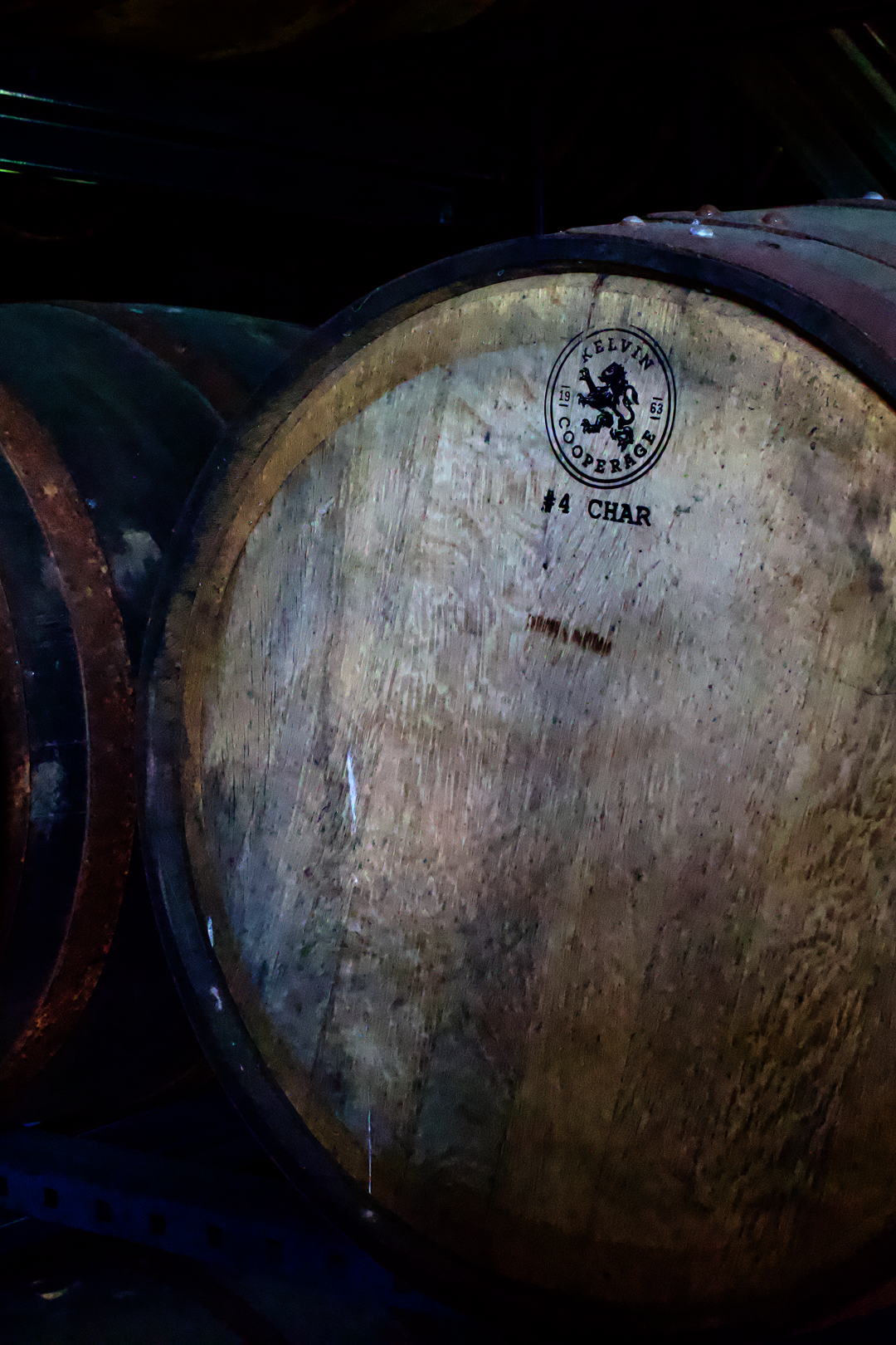 Close up of a Kelvin Cooperage bourbon barrel head stamped with number 4 char.
